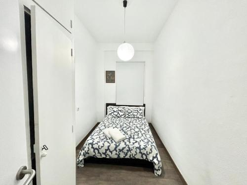 Ένα ή περισσότερα κρεβάτια σε δωμάτιο στο Madrid Rio Antonio López B