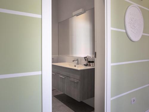 a bathroom with a sink and a mirror at Euterpe LHT in Agrigento