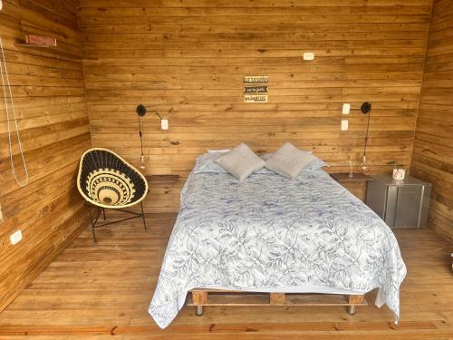 מיטה או מיטות בחדר ב-La Chagra VIP