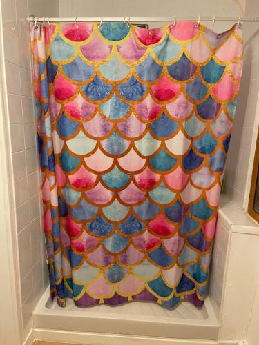 a shower curtain with an octopus pattern on it at Nor50 - Pont Farcy - Chalet Papillon in Pontfarcy