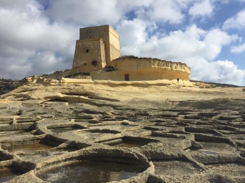 an old building on top of a mountain at Gozo Dwejra Views in San Lawrenz