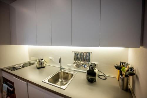 a kitchen with a sink and a counter top at 46 Santa Marta in Lecco