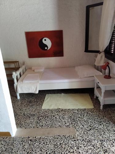 a room with two beds and a table at Ioanna's house #dialiskari1# in Limnionas