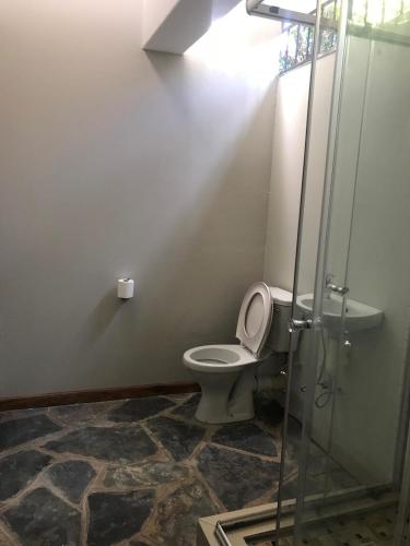 a bathroom with a toilet and a shower at 15 On Reitz Bela bela in Bela-Bela