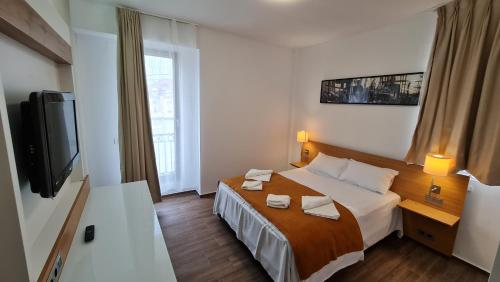Postel nebo postele na pokoji v ubytování Jafar Resort 1