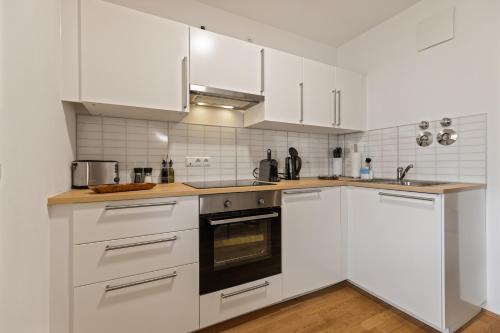 Kuchyň nebo kuchyňský kout v ubytování ma suite - cozy apartment 2P - best location - private Parking