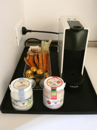 a black counter with some food and a printer at Mine House in Trento