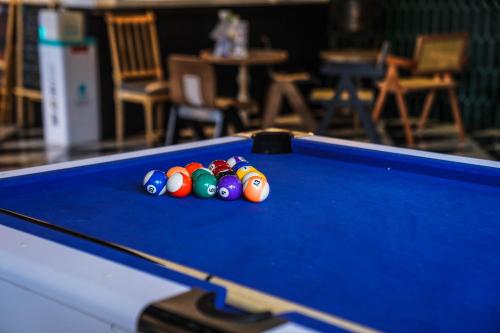 a group of billiard balls on a pool table at Chengdu Local Tea Hostel - Short Walk To Taikooli - Chill & Social Coffee Lounge - Metro downstairs - Free Activities - Friendly English Speaking Staff - Tibet, Panda, Buddha & Snow Mountain Tours in Chengdu