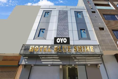 a hotel building with a hotel blue shiners sign on it at OYO Flagship 80943B Hotel Blue Shine in Ludhiana