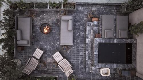 an overhead view of a brick wall with chairs and a fireplace at Monastik Living in Athina in Athens