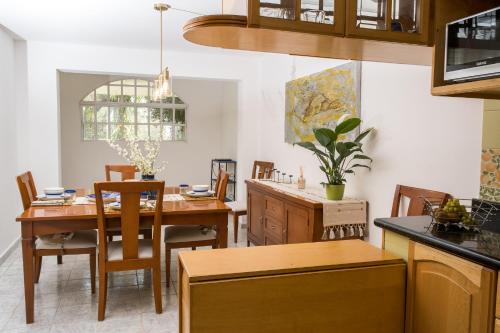 a dining room with a table and chairs at Casa Alegria in Miravalle