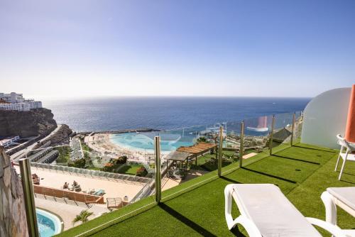 a balcony with a view of the ocean at Serenity Amadores in Puerto Rico de Gran Canaria