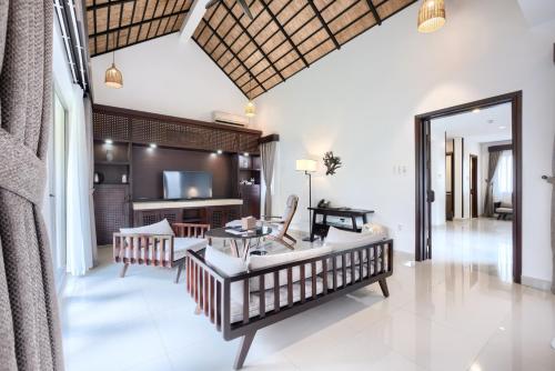 Postel nebo postele na pokoji v ubytování THE BLOSSOM RESORT ISLAND DA NANG - Onsen Included