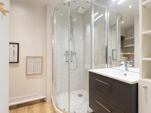 a bathroom with a shower and a sink at Residence Louis Quartier Centre Ville in Vittel