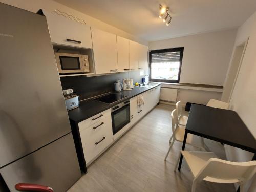 Dapur atau dapur kecil di Guesthouse WI rooms