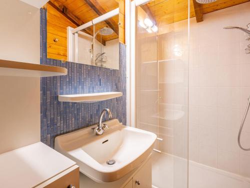 a bathroom with a sink and a shower at Chalet La Clusaz, 5 pièces, 8 personnes - FR-1-304-243 in La Clusaz