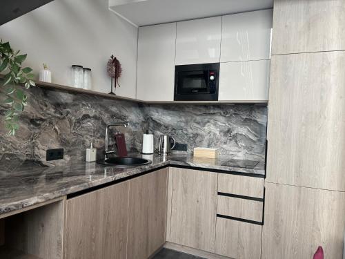 Η κουζίνα ή μικρή κουζίνα στο Cukura Loft