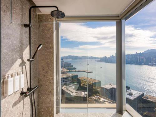a shower with a view of the water at Mondrian Hong Kong in Hong Kong