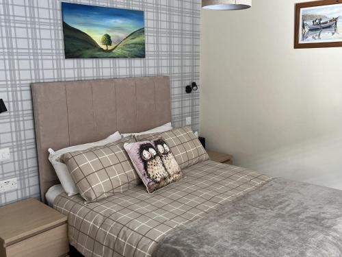 a bedroom with a bed with a pillow on it at Shaftoe's Bed and Breakfast in Haydon Bridge