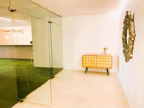 a room with a glass shower and a bench at COLLECTION PORT - B&B Boutique , Alicante Center in Alicante