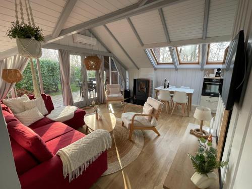 TV a/nebo společenská místnost v ubytování Ferienhaus Kiek in Glücksburg