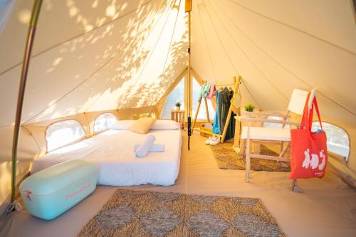 a bedroom with a bed in a tent at Kampaoh Los Escullos in Almería