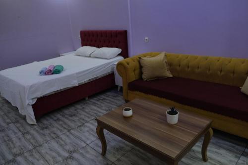מיטה או מיטות בחדר ב-GRAND CLOVER SUİT