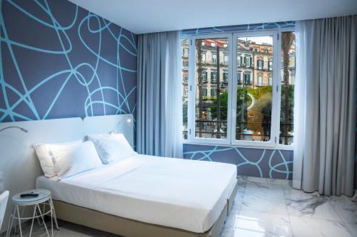 Postel nebo postele na pokoji v ubytování Soul Art Hotel