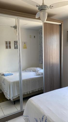 Ένα ή περισσότερα κρεβάτια σε δωμάτιο στο Lar puro aconchego ambiente interativo climatizado e compartilhado