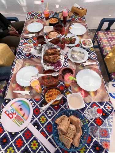a table full of food and plates of food at Endo Mando in Shellal
