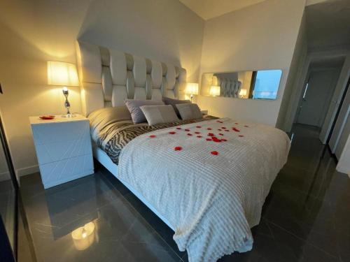 a bedroom with a bed with red roses on it at Benidorm Beach Belluba luxury bay in Benidorm