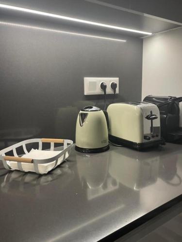 two toasters sitting on a counter in a kitchen at Benidorm Beach Belluba luxury bay in Benidorm