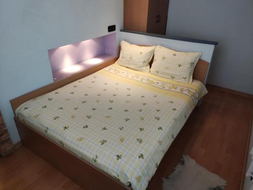 a small bed in a room with at Rila Apartment in Samokov