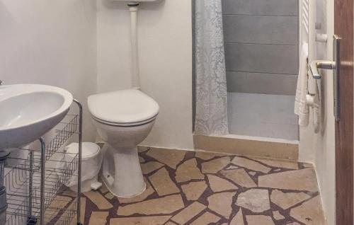 a bathroom with a toilet and a sink and a shower at Beach Front Home In Gradac With House Sea View in Gradac