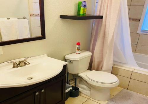 a bathroom with a white toilet and a sink at Modern 2 Bed One Bath At West Side in New York