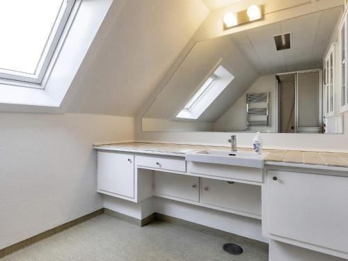 a bathroom with a sink and a mirror at Holiday home Faaborg XXVII in Fåborg