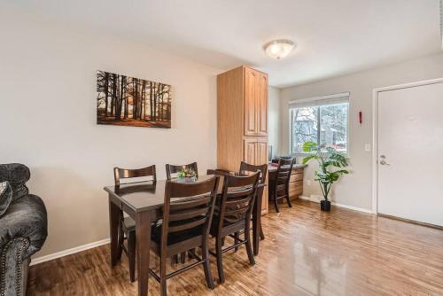 a dining room with a table and chairs at Centrally located for adventures in Westminster