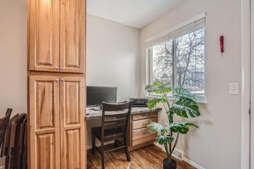 a home office with a desk and a window at Centrally located for adventures in Westminster