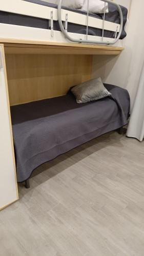 a bunk bed in a room with a pillow on it at Casa di Nonna Margherita in Trecase