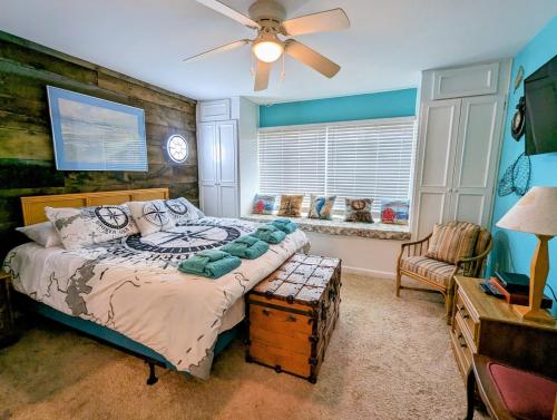 a bedroom with a bed and a ceiling fan at Casa Wanderlust at Harbor Island K204 in Oceanmarsh Subdivision