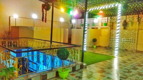 una camera con balcone e piscina interna di Hotel Stay Revoli - Just Half k.m From Golden Temple ad Amritsar