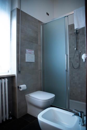 a bathroom with a shower and a toilet and a sink at Villa Aldo e Lalla in Rozzano