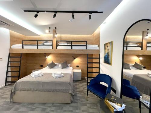 a bedroom with two bunk beds and a mirror at NPL CODE in Sarajevo