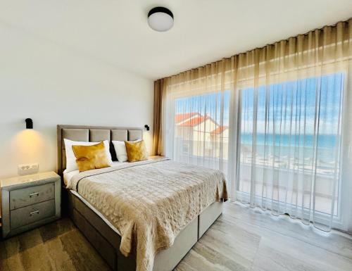 Ένα ή περισσότερα κρεβάτια σε δωμάτιο στο Apartments THE BEACH RESORT VIR