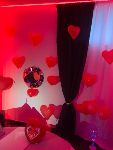 a room with red hearts on the wall at 50m2 Suite in Capurso
