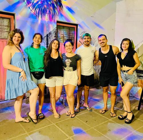 a group of people posing for a picture at a party at Lacandona Hostel in Cordoba