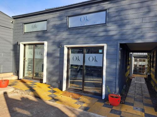 a blue building with the words ok on it at Okeyloft, Coyhaique 2 in Coihaique