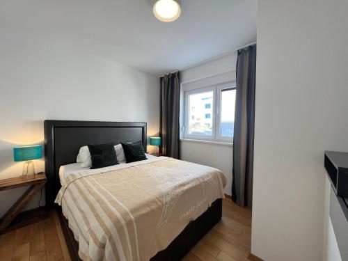 Ένα ή περισσότερα κρεβάτια σε δωμάτιο στο Apartments THE BEACH RESORT VIR