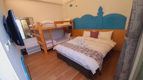 Ein Bett oder Betten in einem Zimmer der Unterkunft Yurong B&B