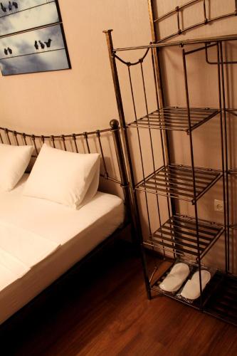a bedroom with a bunk bed and a shelf next to a bed at Royal Venezia Hotel in Batumi